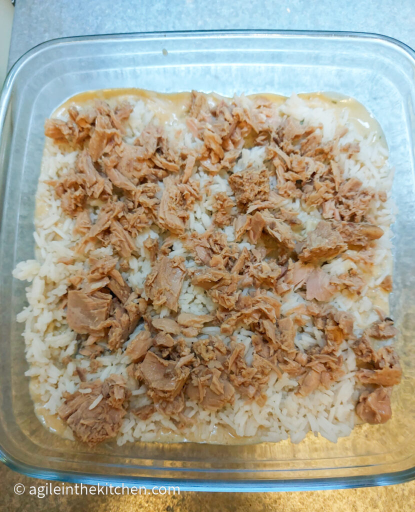 Creamy Tuna Bake, layered with Béchamel sauce, white rice and flaky tuna pieces.